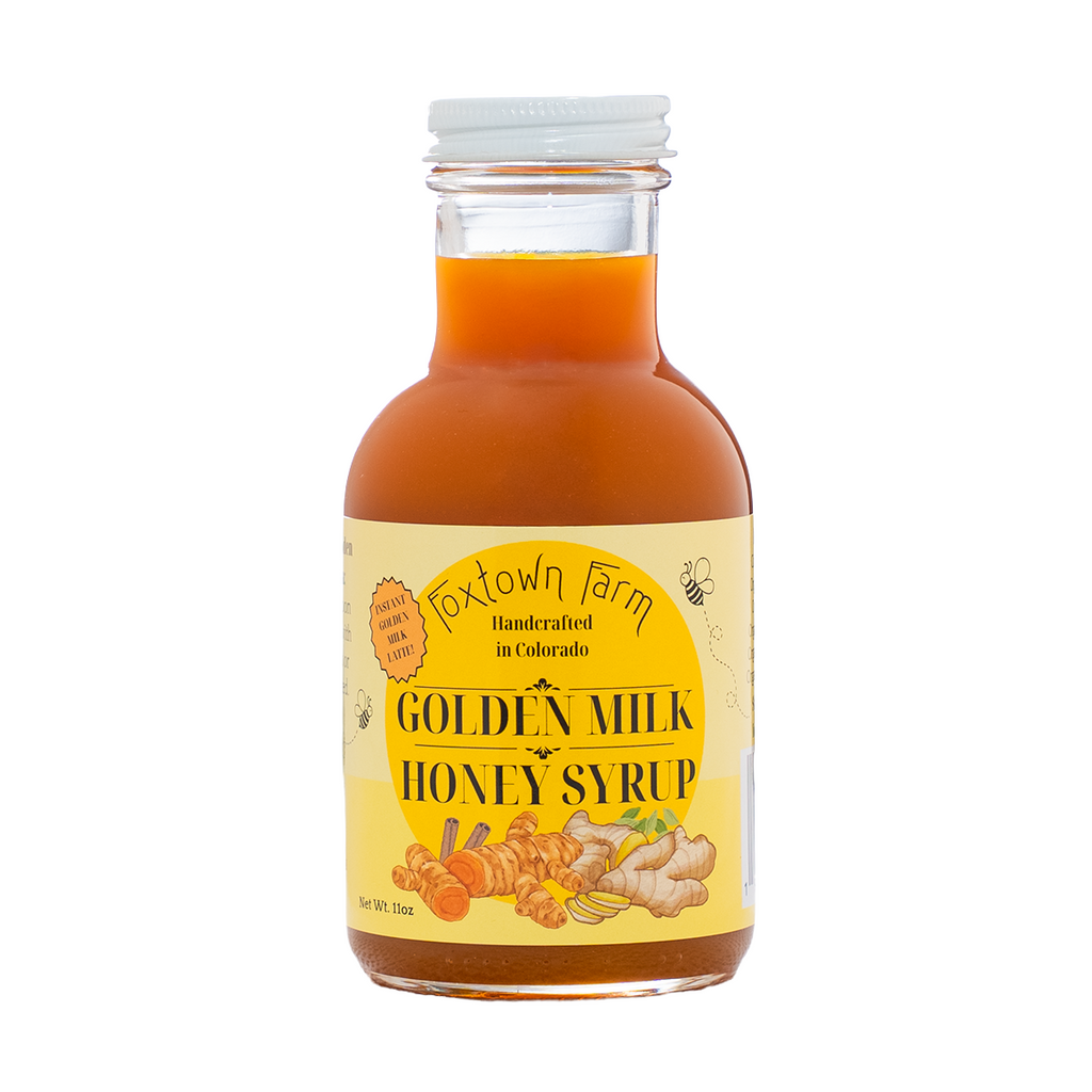 Front view of 11 oz Golden Milk Honey Syrup made with organic turmeric, ginger, warming spices and pure honey.