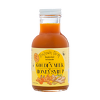 Front view of 11 oz Golden Milk Honey Syrup made with organic turmeric, ginger, warming spices and pure honey.